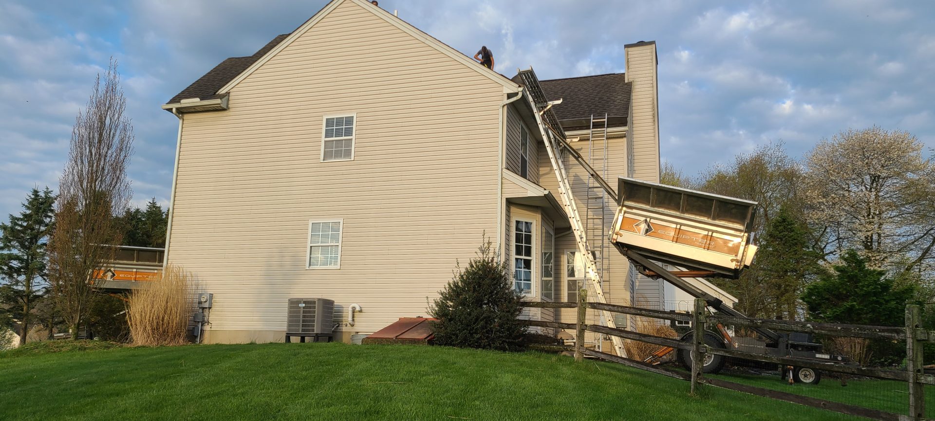 black asphalt roofing replacement being performed by local roofing contractors